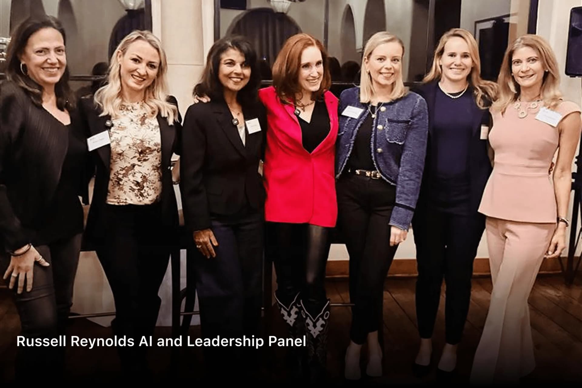 Panelists standing together at the Russell Reynolds AI and Leadership Panel